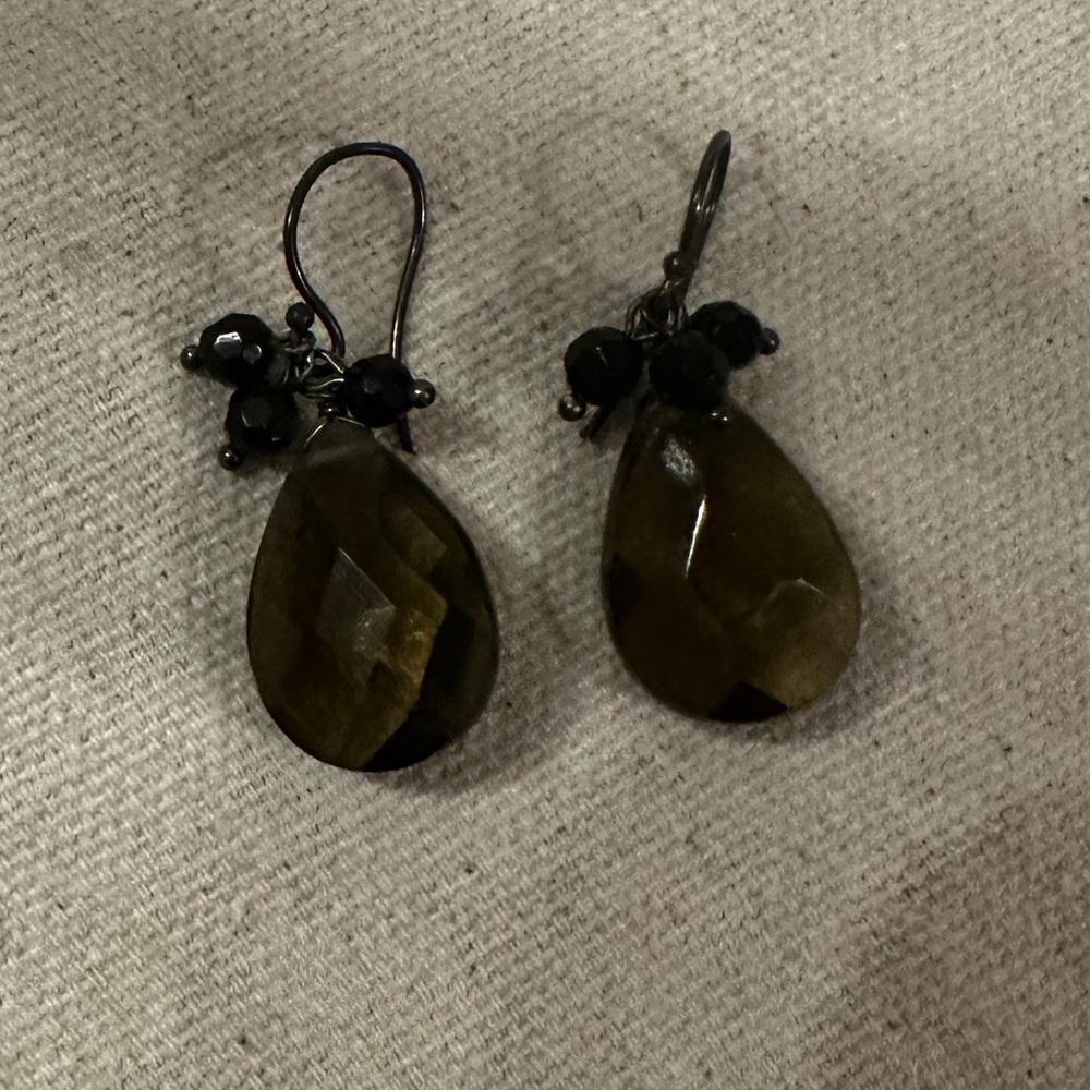 Emerald green crystal drop earrings with black crystals.